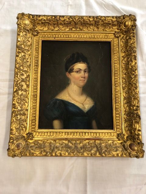 Portrait dans un cadre en stuc rectangulaire de 40x35. 